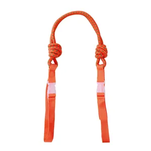 Detailed view of durable orange nylon crossbody strap extension with white buckles.