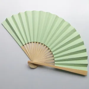 Detail view of a 9-inch light green blank folding fan for wedding decor