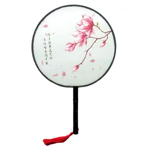 Traditional Chinese silk round fan featuring elegant magnolia pattern and red tassel
