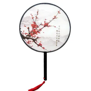 Traditional Chinese round fan featuring elegant red plum blossom painting and tassel