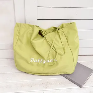 Large capacity light green canvas tote bag with white embroidery and minimalist lazy style