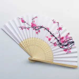 Detail of 21cm Chinese bamboo folding fan with pink plum blossom pattern on white surface.