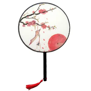 Traditional Chinese ancient style round fan with plum blossom pattern and red tassel