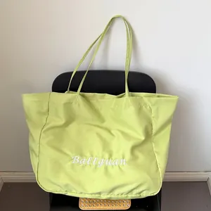 Large capacity lime green canvas commute tote bag with white Ballguan cursive embroidery
