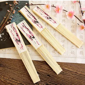 Traditional ink wash style folding fans with pink plum blossom art on bamboo frames