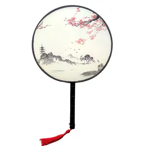 Traditional Chinese silk round fan with landscape ink painting and elegant red tassel