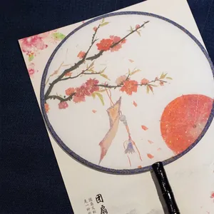 Traditional Chinese silk circular fan featuring elegant red plum blossom patterns
