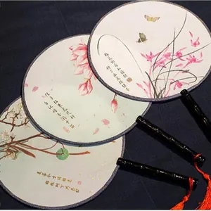 Traditional Chinese style round fans with floral patterns and red tassels for Hanfu