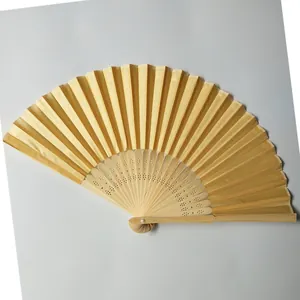 Elegant golden silk folding fan with intricately carved natural bamboo ribs for summer