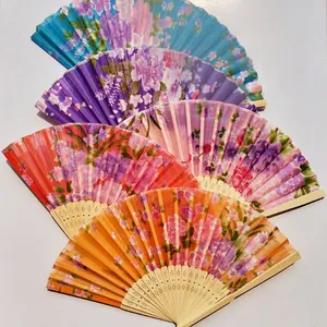 Set of 5 floral printed Japanese style folding fans with bamboo ribs on white background.