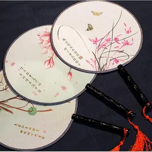 Traditional Chinese vintage round fan with elegant floral painting and red silk tassel