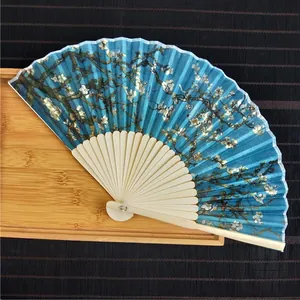 Detailed view of a premium bamboo folding fan featuring Van Gogh's Almond Blossom art print