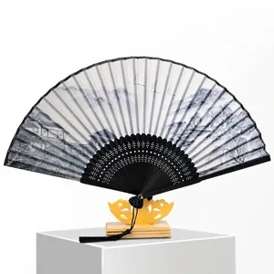 Traditional 6-inch Chinese folding fan with ink landscape painting and display stand