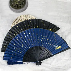 Detail of Chinese style folding fans with gold foil starry sky constellation patterns