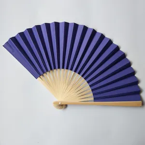 Close-up view of a high-grade 23cm deep purple paper fan with natural bamboo ribs