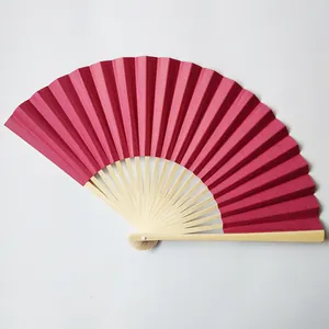 Detail view of high-quality 23cm dark pink paper folding fan with natural bamboo ribs