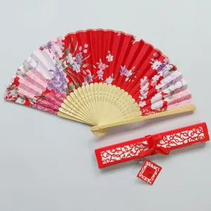 Japanese satin folding fan with cherry blossom pattern and matching hollow-out gift box