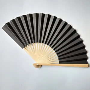 Detailed top view of a 23cm black folding paper fan with natural bamboo ribs