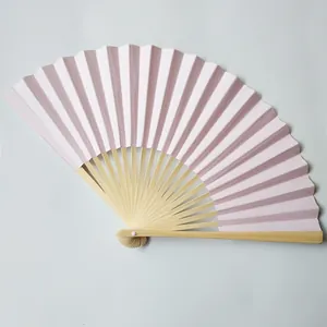 Detailed macro view of a 23cm light pink paper folding fan featuring premium bamboo ribs