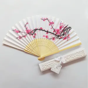 Exquisite Japanese cherry blossom folding fan with elegant white hollow gift box detail