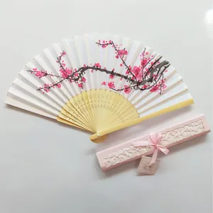 Japanese folding fan with cherry blossom pattern and elegant hollowed pink gift box