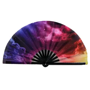 Detailed view of the vibrant nebula print on a high-quality bamboo folding kung fu fan