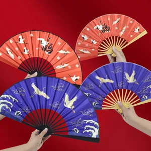 Traditional Chinese style folding fan with crane patterns and bamboo ribs, red and blue colors.
