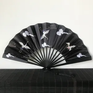 Traditional 23cm black folding fan with white crane pattern and silk tassel accessory