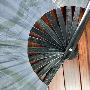 Close-up detail of 33cm black bamboo ribs and sturdy hinge on a folding Kung Fu fan