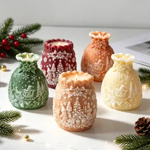 Detailed view of five festive Christmas lucky bag scented candles with 3D embossing