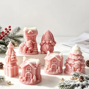 Detail view showing pink Christmas candle molds with intricate Santa and tree textures