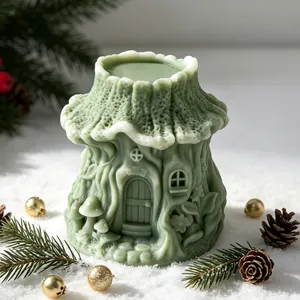 Detailed sage green treehouse candle with intricate textures in a festive snow setting
