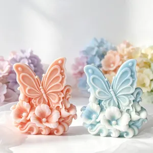 Close-up of 3D butterfly and flower relief aromatherapy candles in pastel pink and blue