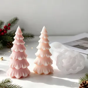 Detailed view of 3D Christmas tree silicone candle mold with finished pink wax candles