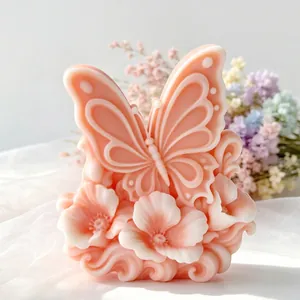 Detailed butterfly and floral embossed pink aromatherapy candle with intricate carving