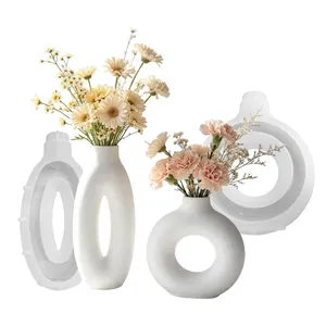 Detailed view of silicone molds for oval and circular vases with finished DIY examples