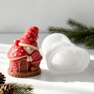 Close-up of a festive red mushroom house gnome candle and its white silicone mold