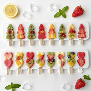Detailed view of 8-cavity silicone popsicle molds with heart and Christmas tree shapes.
