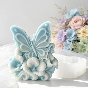 Detailed view of embossed butterfly flower candle mold and finished plaster craft