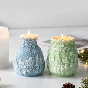 Close-up of lit Christmas money bag candles with intricate festive carvings and relief
