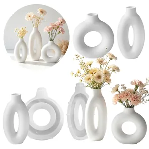 Comparison of geometric donut vase silicone molds and finished white resin flower vases