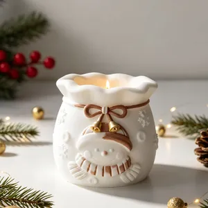 Detailed macro view of a white Christmas snowman pouch candle holder with festive decor