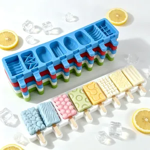 Detail view of 8-cavity silicone popsicle mold with various geometric patterns.