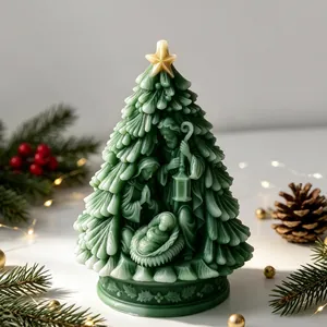 Intricate Nativity scene carved into a green Christmas tree candle with gold star top