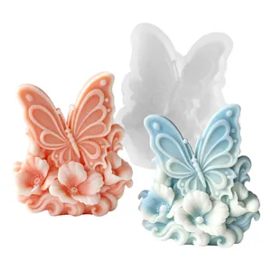 Detail view of butterfly floral relief silicone mold with pink and blue wax samples