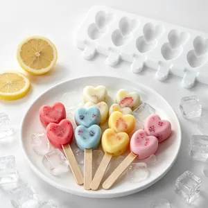 Detail of 8-cavity heart silicone popsicle mold with colorful finished ice creams.