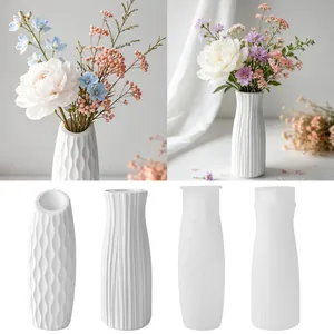 Detailed view of DIY silicone molds for textured plaster and resin flower vases.
