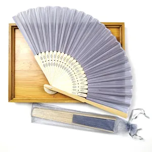 Detail view of lavender silk folding fan with bamboo ribs and organza gift pouch