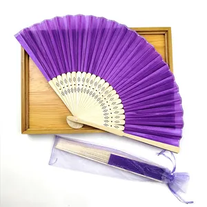 Handcrafted purple silk folding fan with bamboo frame and matching organza gift bag.