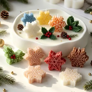 Detailed view of colorful snowflake and holly leaf shaped scented candles for Christmas